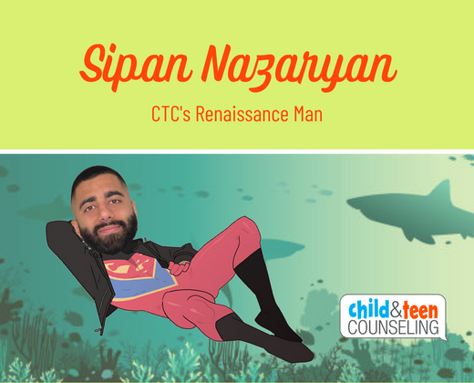 Sipan Nazaryan relaxes casuallly in a super hero outfit with sharks behind him