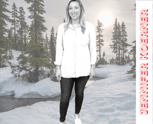 Jennifer Koerner poses with trees and snow in background