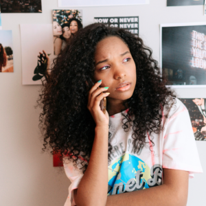 emotionally struggling teen girl on cell phone